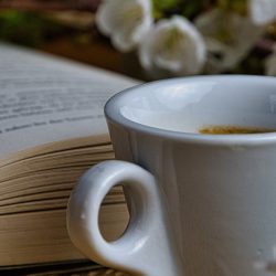 comforting image of a cup of tea and a paperback book