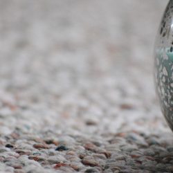 hourglass filled with blue sand