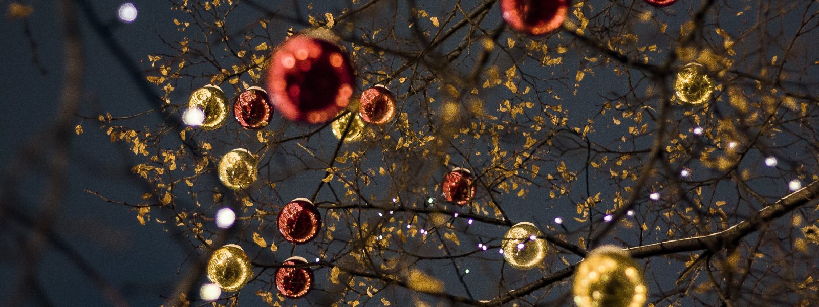 Christmas Baubles against a backdrop of a dark sky